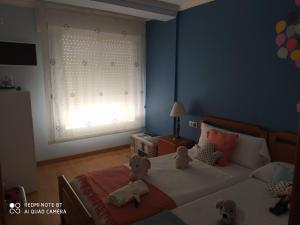 Posteľ alebo postele v izbe v ubytovaní Apartamento Manuel