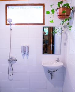 A bathroom at Log Home Villas at Taman Wisata Bougenville
