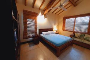מיטה או מיטות בחדר ב-Fincas Panaca Portal 7