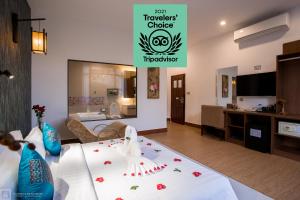 a living room with a room with a hotel at Orussey One Boutique in Phnom Penh