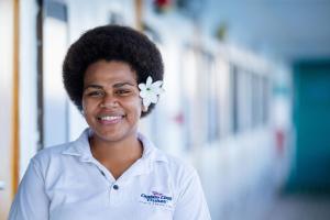 a woman with a flower in her hair at Captain Cook Cruises Fiji in Denarau