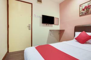 Krevet ili kreveti u jedinici u okviru objekta OYO 90282 Hotel Taj Inn, Seksyen 7