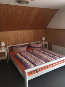 Ein Bett oder Betten in einem Zimmer der Unterkunft Kartoffelkate