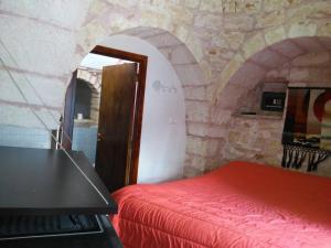 A bed or beds in a room at Trullo Francisco