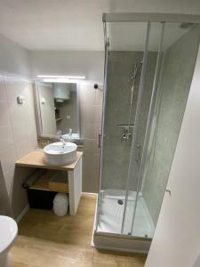 a bathroom with a shower and a sink at Studio 207-Front de mer parking privé in Cavalaire-sur-Mer