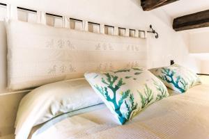 Postel nebo postele na pokoji v ubytování Alghero San Francesco