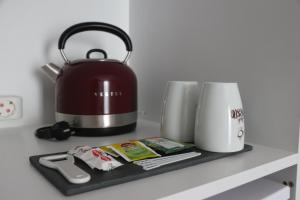 a tea kettle and a toaster on a counter at EXEN BY WEEKEND in Bodrum City