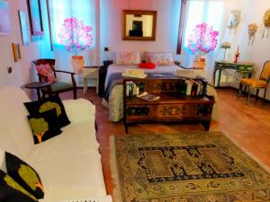 Letto o letti in una camera di Suite Ai Leoni