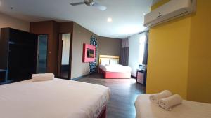 Ліжко або ліжка в номері Sense Hotel Taiping