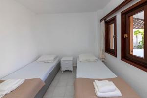 Postel nebo postele na pokoji v ubytování White House with Mediterranean Sea View near Camel Beach in Bodrum