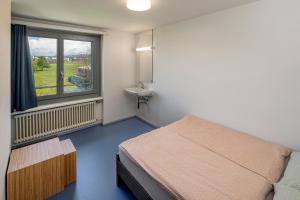Letto o letti in una camera di Rapperswil-Jona Youth Hostel