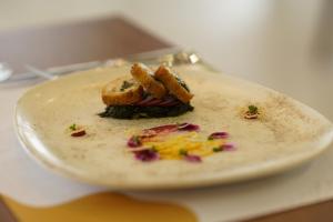 a white plate with a dessert on a table at Sundia Exclusive By Liberty Fethiye Adults Only in Fethiye
