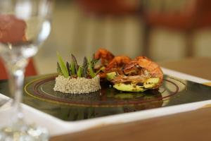 a plate of food with shrimp on a table at Sundia Exclusive By Liberty Fethiye Adults Only in Fethiye