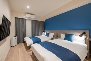 Ένα ή περισσότερα κρεβάτια σε δωμάτιο στο hotel aima