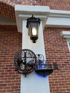 a street light on the side of a brick building at Loving kinmen Homestay in Jincheng