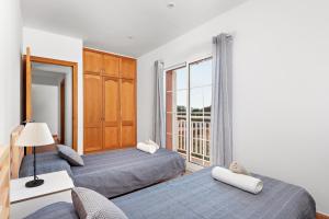 Ένα ή περισσότερα κρεβάτια σε δωμάτιο στο Villa Menorca BAY 4 by Mauter Villas +20 φωτογραφίες