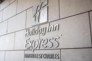 a sign on the side of a building at Holiday Inn Express Marseille Saint Charles, an IHG Hotel in Marseille