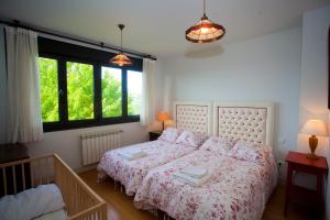 Ένα ή περισσότερα κρεβάτια σε δωμάτιο στο Brisas de Caravia