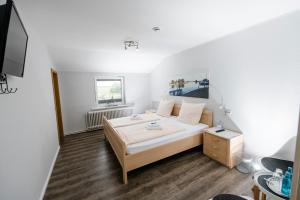TV a/nebo společenská místnost v ubytování Zum Alten Fährhaus - Bed & Breakfast