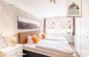 En eller flere senge i et værelse på Apartments Unter Dem Schloß