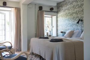 Postel nebo postele na pokoji v ubytování Gumbalde Resort