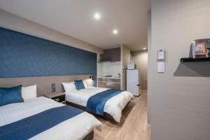 Postel nebo postele na pokoji v ubytování hotel aima