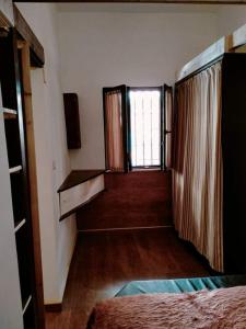 a room with a bed and a window in it at Villetta vicino al mare con posto auto privato in Pescara