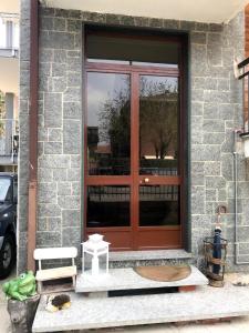 a front door of a house with a red door at Guest House MICINI in Druento