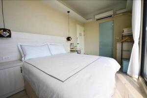 Cama o camas de una habitación en 嵵裡仙人掌海景民宿Ocean view room
