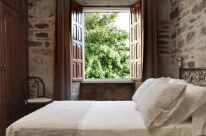 A bed or beds in a room at Sete Artes by Como en Casa