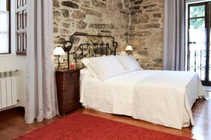 A bed or beds in a room at Sete Artes by Como en Casa