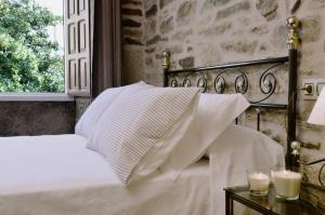 A bed or beds in a room at Sete Artes by Como en Casa