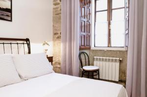 A bed or beds in a room at Sete Artes by Como en Casa