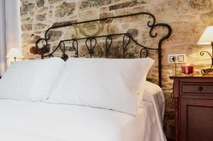 A bed or beds in a room at Sete Artes by Como en Casa