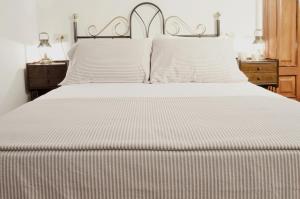 A bed or beds in a room at Sete Artes by Como en Casa