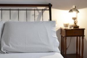 A bed or beds in a room at Sete Artes by Como en Casa