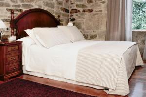 A bed or beds in a room at Sete Artes by Como en Casa