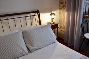 A bed or beds in a room at Sete Artes by Como en Casa