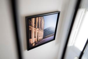 a reflection of a building in a mirror on a wall at Antica Pepice in Matera