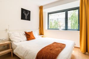 Un pat sau paturi într-o cameră la Smart & Green Living by Ambiente