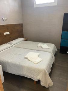 Кровать или кровати в номере A Fontana de Luxo Apartamentos