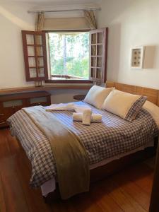 Llit o llits en una habitació de Apartamento lindo e aconchegante em Capivari.