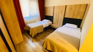 Кровать или кровати в номере Kaya Residence