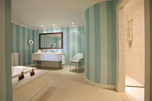 a bathroom with a sink and a tub and a bathroom with a sink at The Yeatman in Vila Nova de Gaia