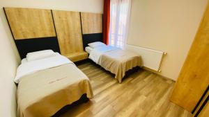 Кровать или кровати в номере Kaya Residence