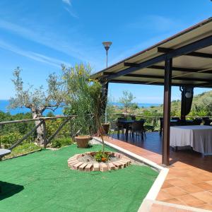 a pavilion with a table and a table and a tableablish at Agriturismo Agri Armonia in San Lucido