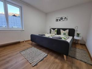 a bedroom with a bed in a room with a window at Pension Bergfried in Hallstatt