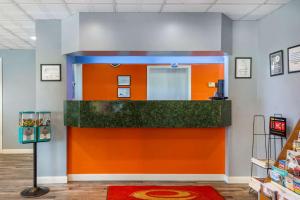 an orange and blue counter in a store at Econo Lodge in Cortland