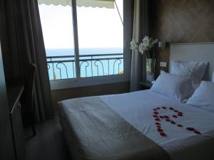 Postel nebo postele na pokoji v ubytování Hotel de charme Regency