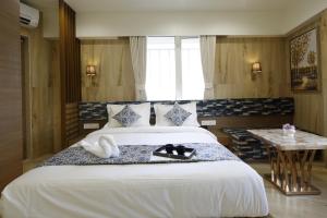 Letto o letti in una camera di Hotel Elysian Residency